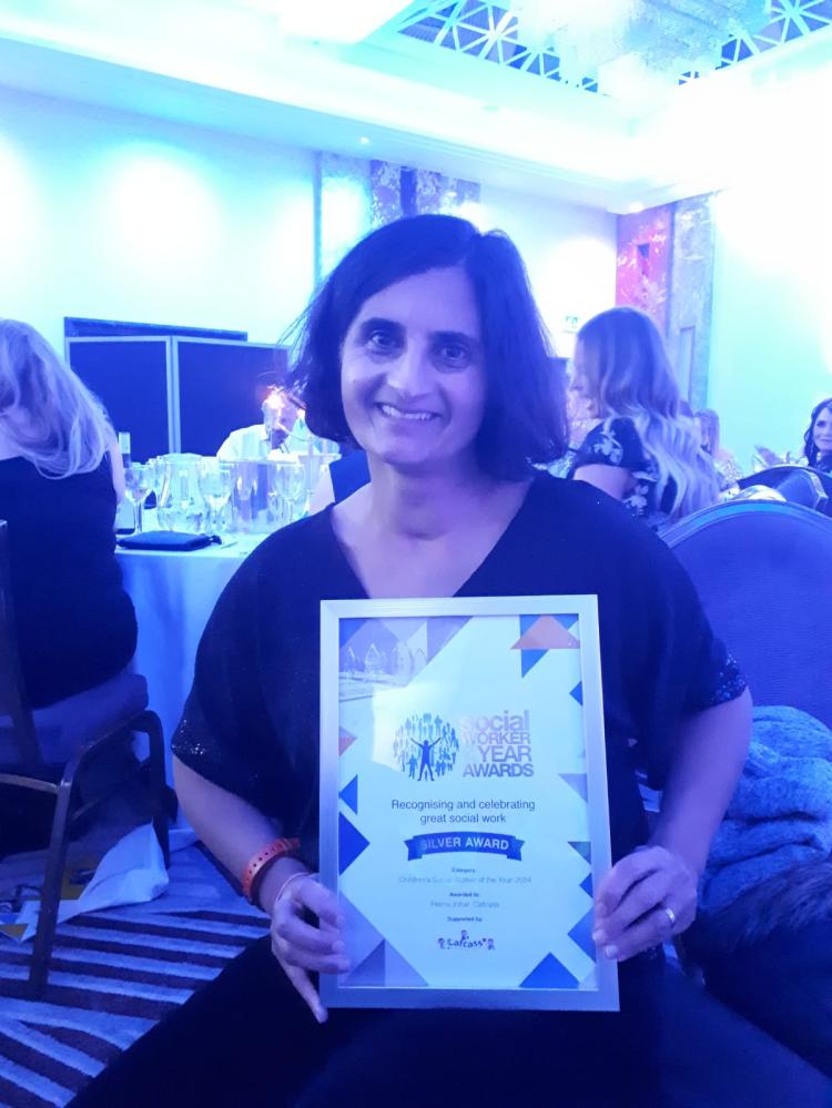 Image of woman holding a certificate