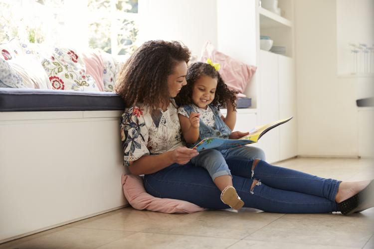 A woman reads a story to a child
