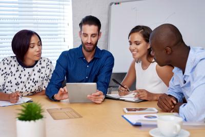 A group of people working with technology