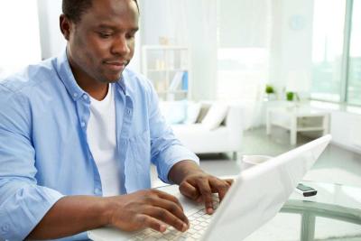 A man viewing health and wellbeing content on a laptop